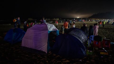 People set up tents to wait to see the launch of Long March-7A on March 12 in Wenchang, Hainan, China.