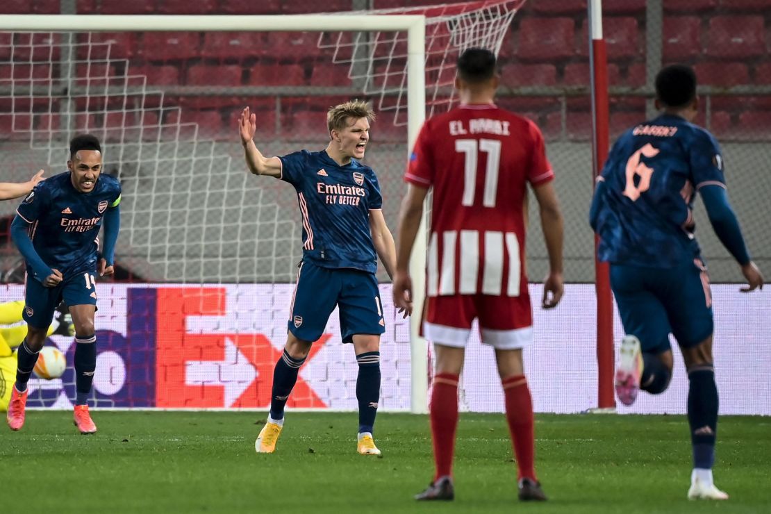 Odegaard celebrates after scoring his team's first goal against Olympiacos.