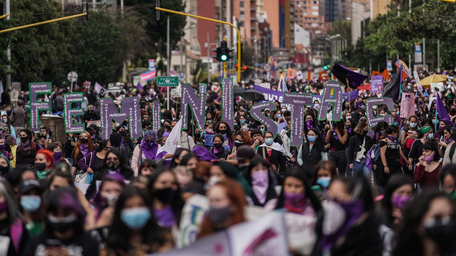 Demonstrators hold a banner during an International Women's Day rally in Bogota, Colombia, on March 8, 2021. 