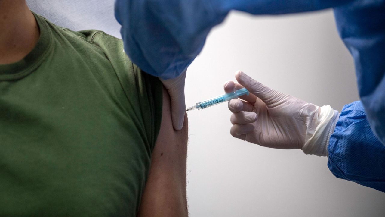 ROME, ITALY - MARCH 05: A healthcare worker of the Italian Army gives the AstraZeneca COVID-19 vaccine to a soldier, as part of COVID-19 vaccinations plan for the military personnel, on March 5, 2021 in Rome, Italy. The Italian government blocked the shipment of 250,000 doses of the Oxford/AstraZeneca vaccine developed by the Anglo-Swedish group and produced in a factory near Rome. This is the first time that a European country has applied new rules to control vaccine exports, adopted in January. (Photo by Antonio Masiello/Getty Images)