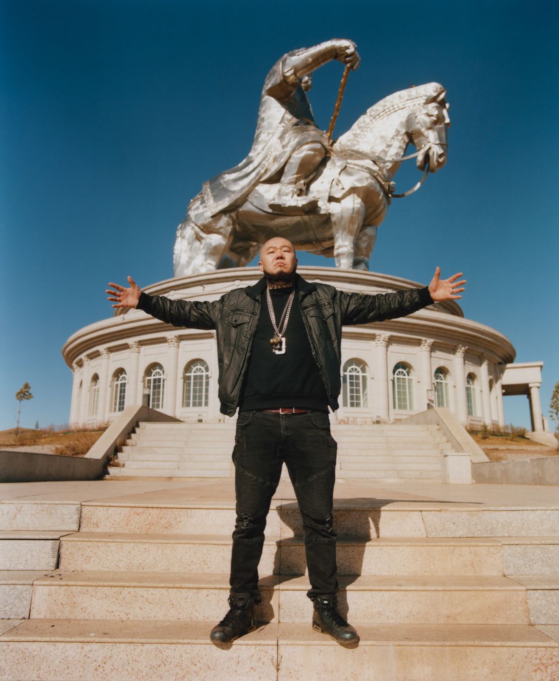 Big Gee poses in front of a Genghis Khan statue in Ulaanbaatar.