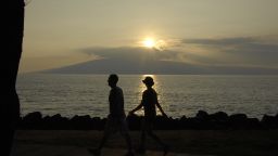 Maui .Hawaii islands ,USA_Vacationers walking on maui islan Hawaii beach during sunset 16 January 2015 Photo by Francis Joseph Dean/Deanpictures) (Photo by Francis Dean/Corbis via Getty Images)