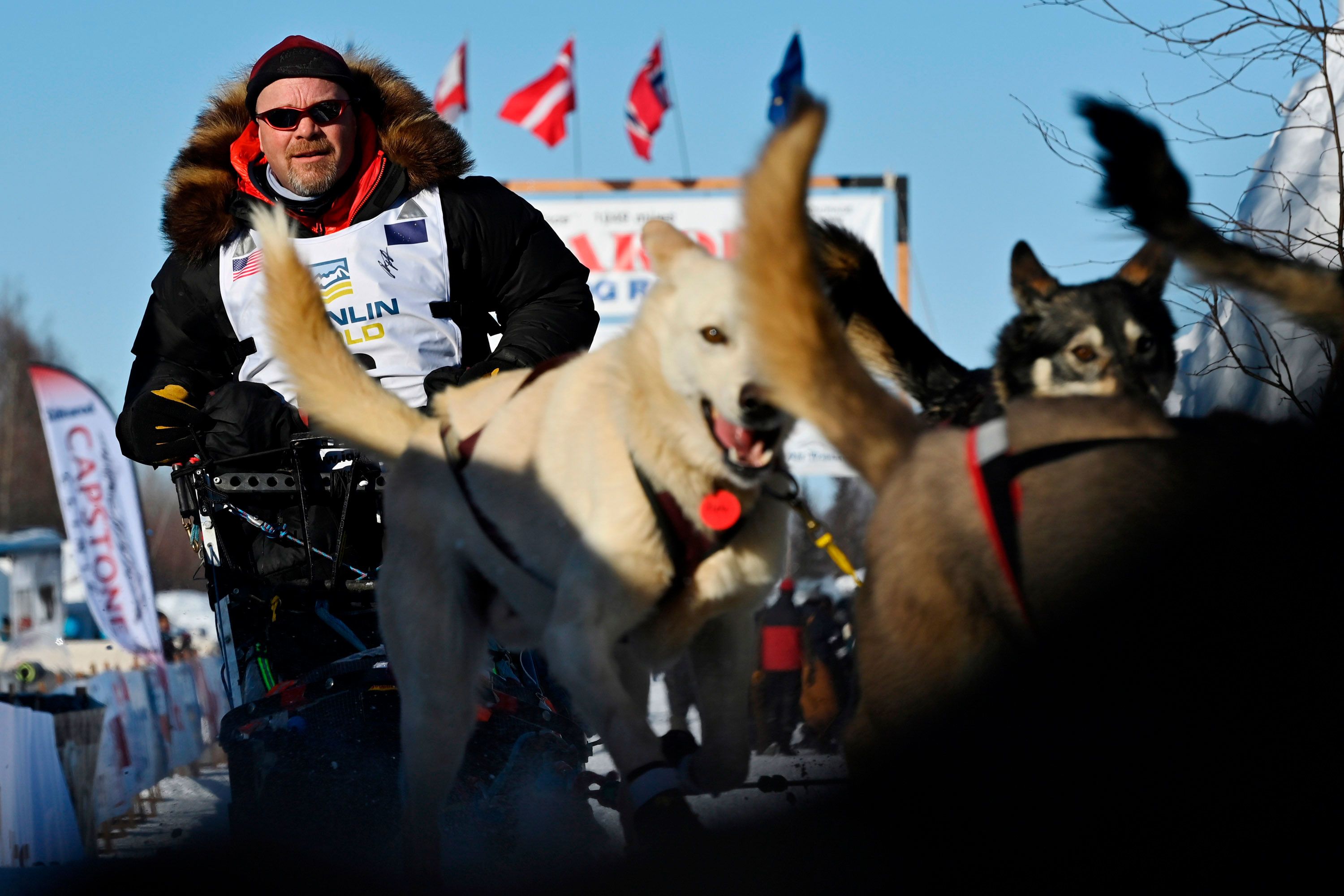 Aaron Burmeister and his team of dogs leave the Iditarod starting area in Willow, Alaska, on Sunday, March 7.