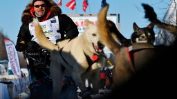 Aaron Burmeister and his team leave the starting area of the Iditarod Sled Dog Race at Deshka Landing in Willow, Alaska, Sunday, March 7, 2021. (Marc Lester/Anchorage Daily News via AP, Pool)