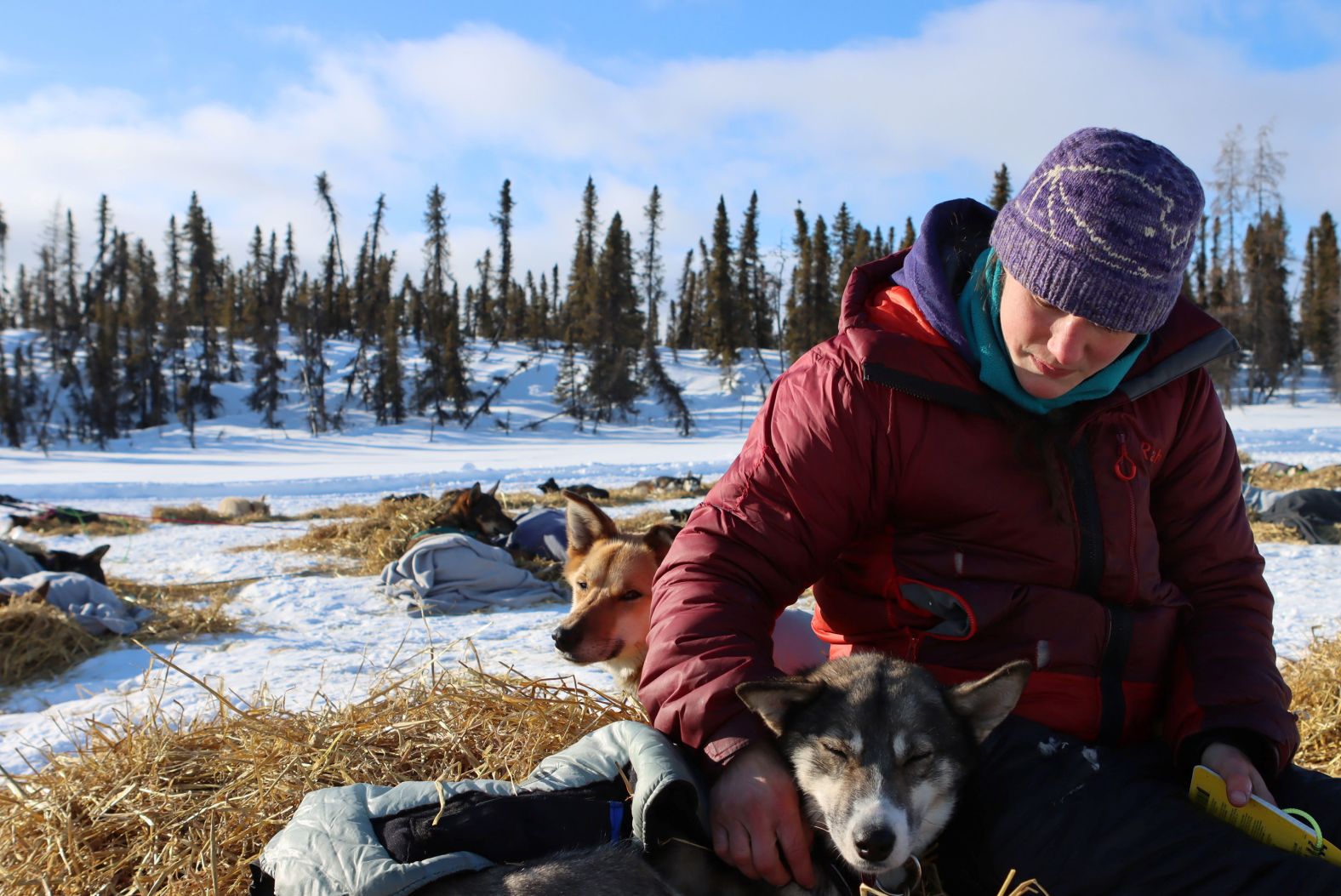 Ryne Olson sits with her 7-year-old dog Dolly, who is named after Dolly Parton, at the Ophir checkpoint on Wednesday, March 10.