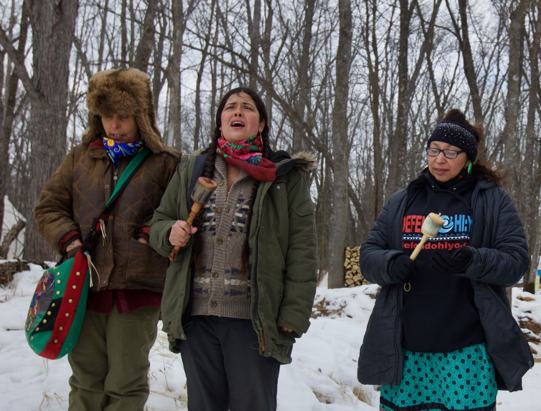 Native Americans sing near the site of a planned Enbridge dig. 