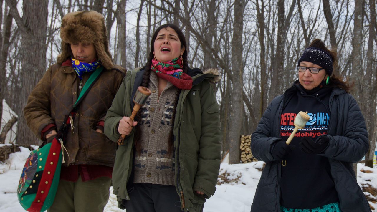 Native Americans sing near the site of a planned Enbridge dig.