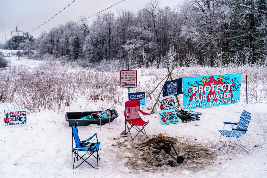 An anti-trespass notice is surrounded by signs protesting the  construction on the Enbridge Line 3 crude oil pipeline. 