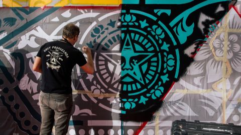 Shepard Fairey painting his first mural in the Middle East at Dubai Design District.