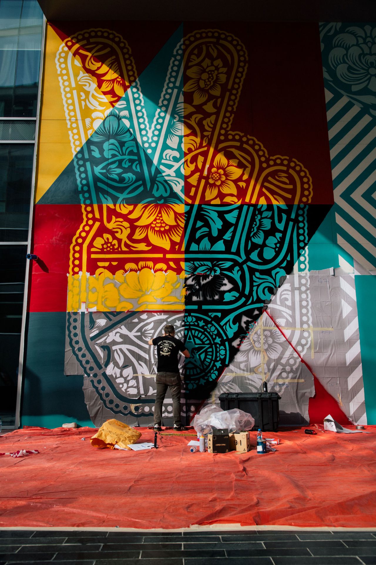 Shepard Fairey painting his first mural in the Middle East in Dubai's Design District.