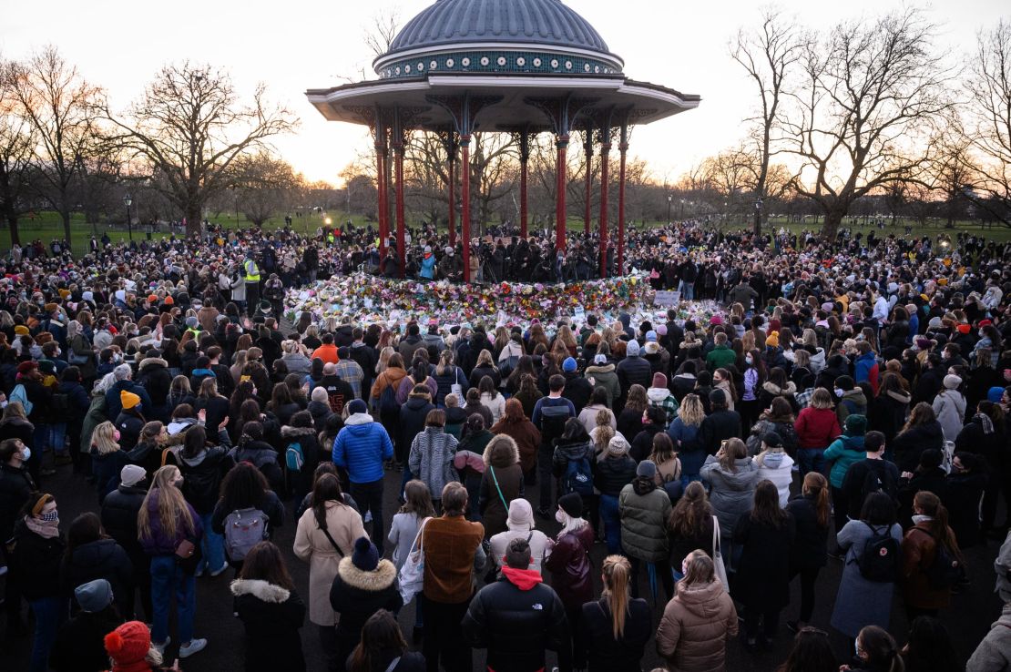 People gather to pay their respects at a vigil on Clapham Common, where floral tributes have been placed for Sarah Everard on March 13, 2021 in London, England.