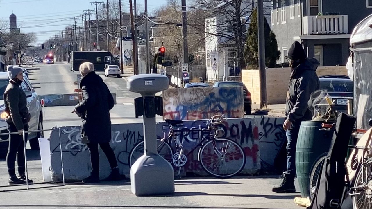 The city first put in the concrete barriers, but then residents and activists added more obstacles and started to control the area.