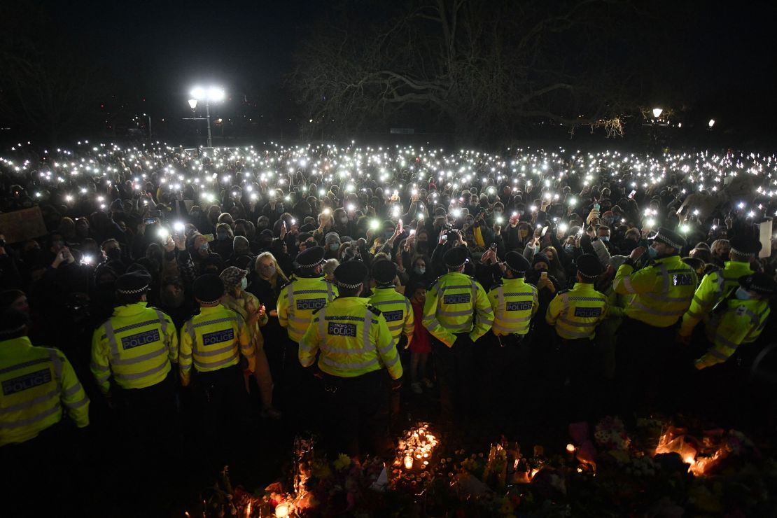Police officers form a cordon at the Everard vigil in London on March 13.