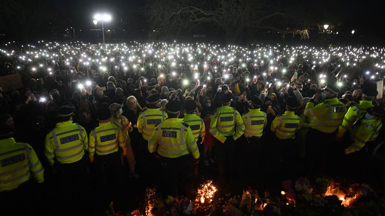 Police officers form a cordon around the Clapham Common bandstand in south London on March 13, 2021, where people had gathered for the Sarah Everard vigil.