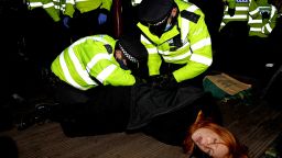 Mandatory Credit: Photo by James Veysey/Shutterstock (11798757aa)A woman is arrested at a vigil in memory of murdered Sarah Everard.Sarah Everard vigil, Clapham, London, UK - 13 Mar 2021