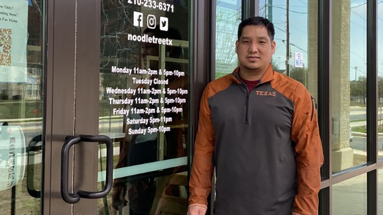 Mike Nguyen stands outside his San Antonio restaurant, Noodle Tree.