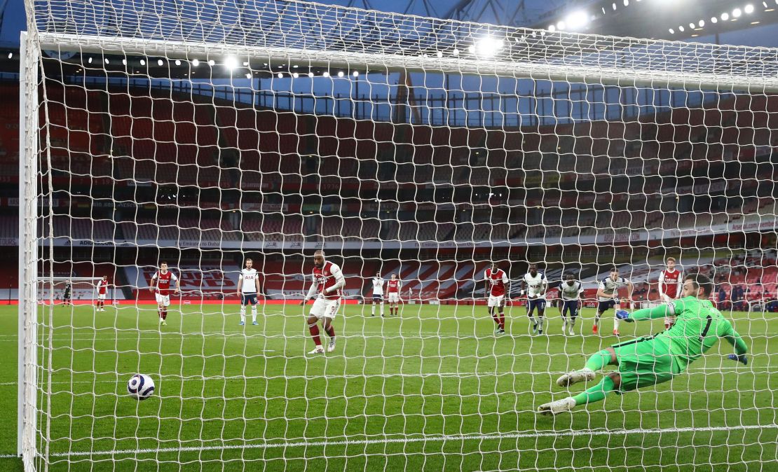 Lacazette shoots from the penalty spot to score his team's second goal.