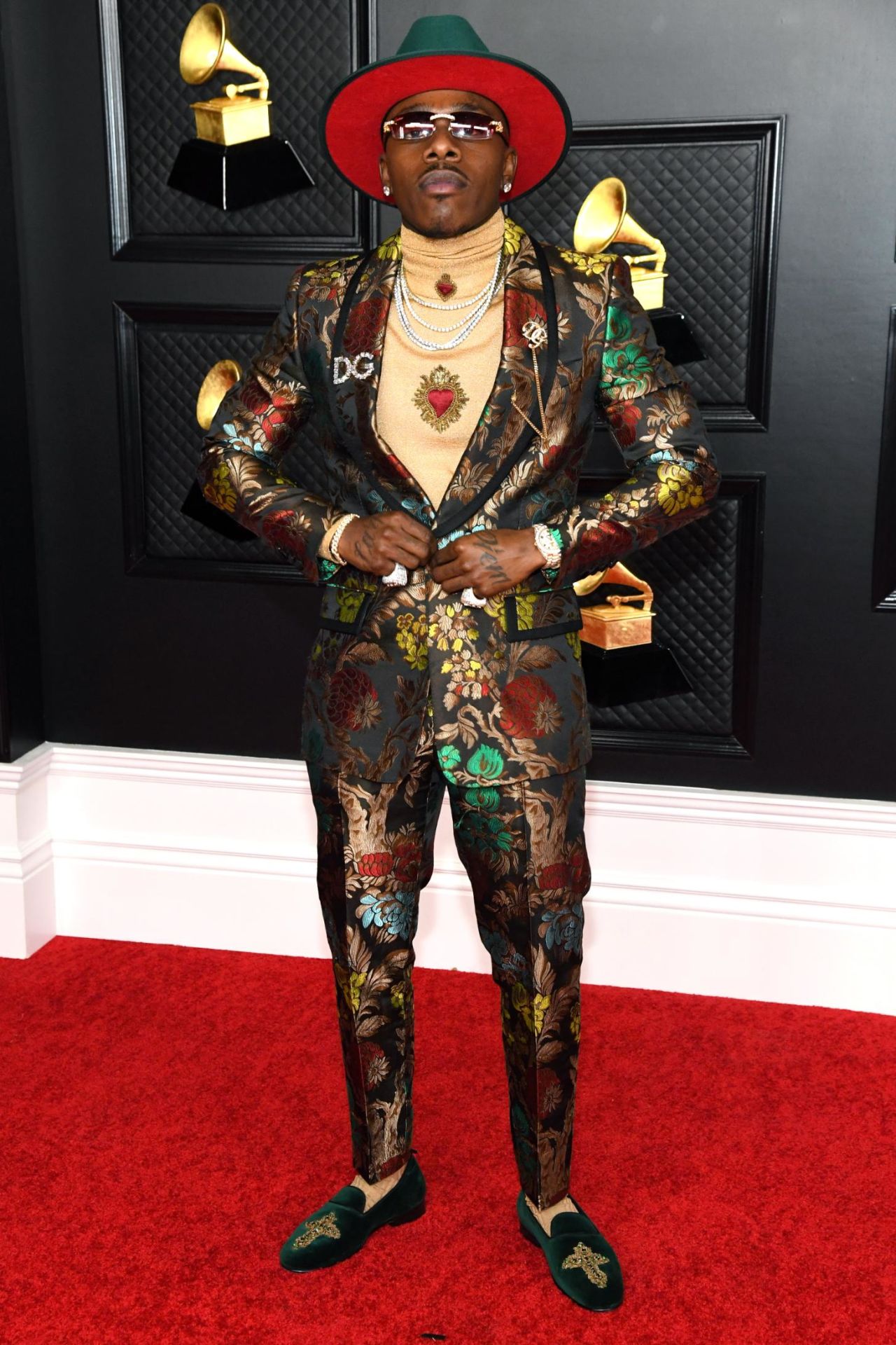 DaBaby arrives at the ceremony in a bold head-to-toe look by Dolce and Gabbana. 