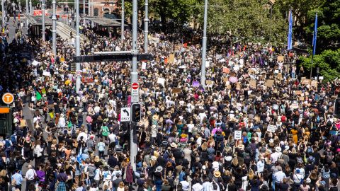 Crowds join the women's March for Justice outside Sydney's Town Hall on March 15, 2021.