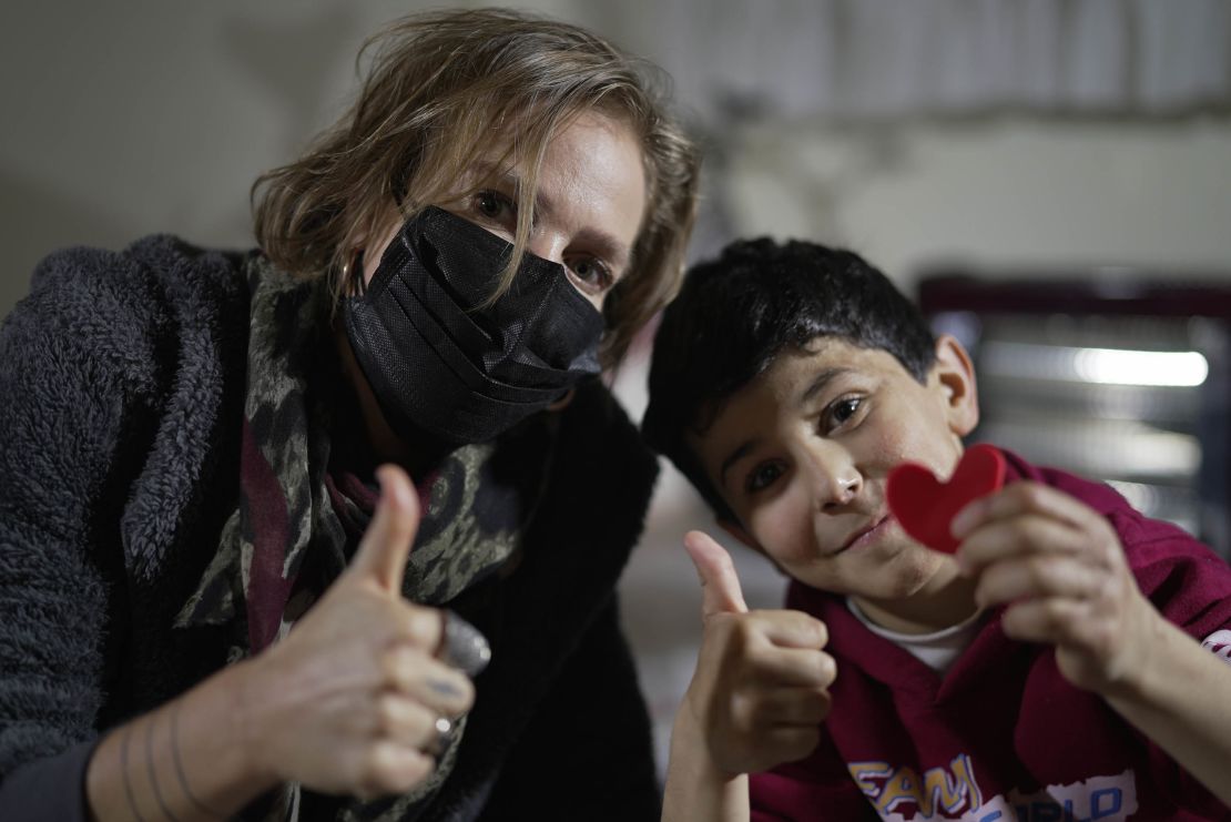 CNN's Arwa Damon with 10-year-old Sultan who suffered from burns after an attack near him in Idlib.