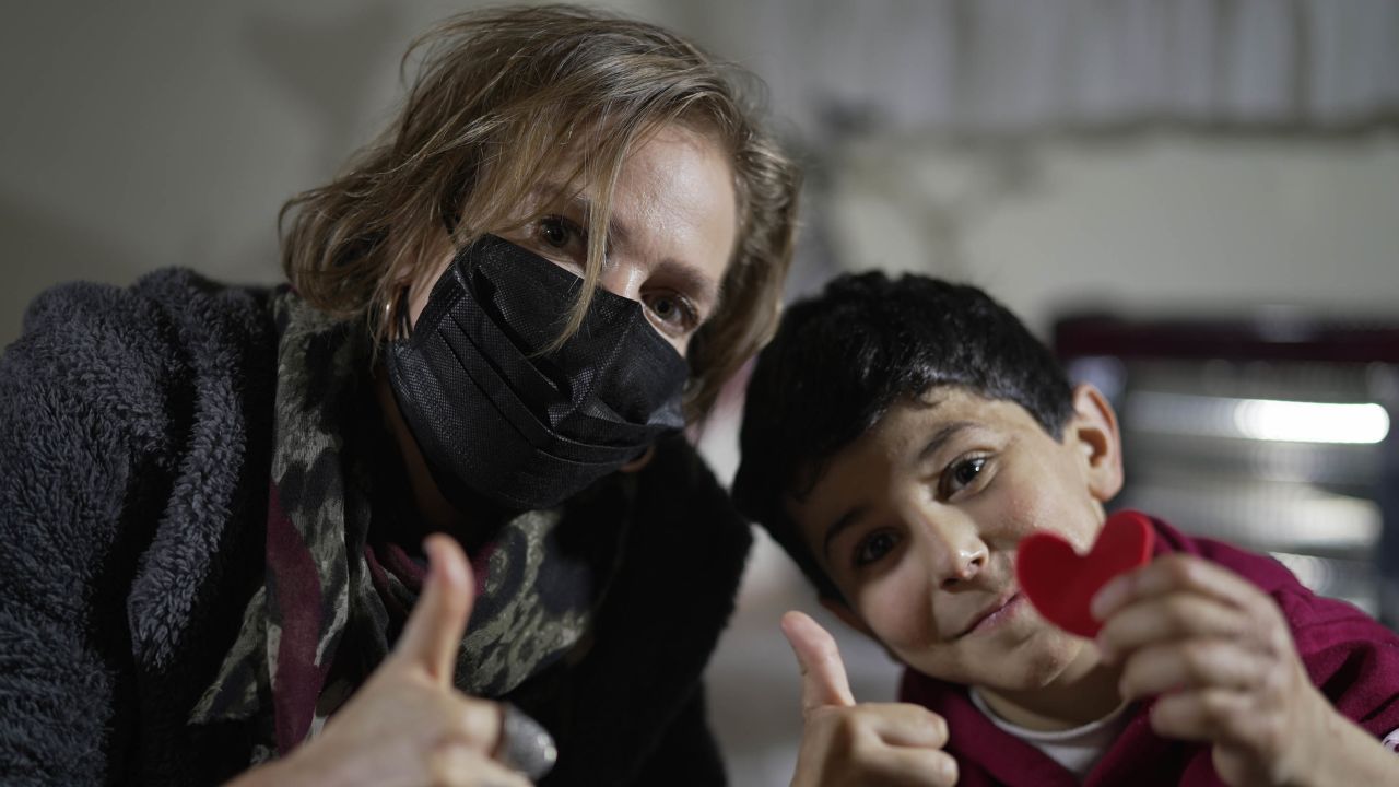 CNN's Arwa Damon with 10-year-old Sultan who suffered from burns after an attack near him in Idlib.