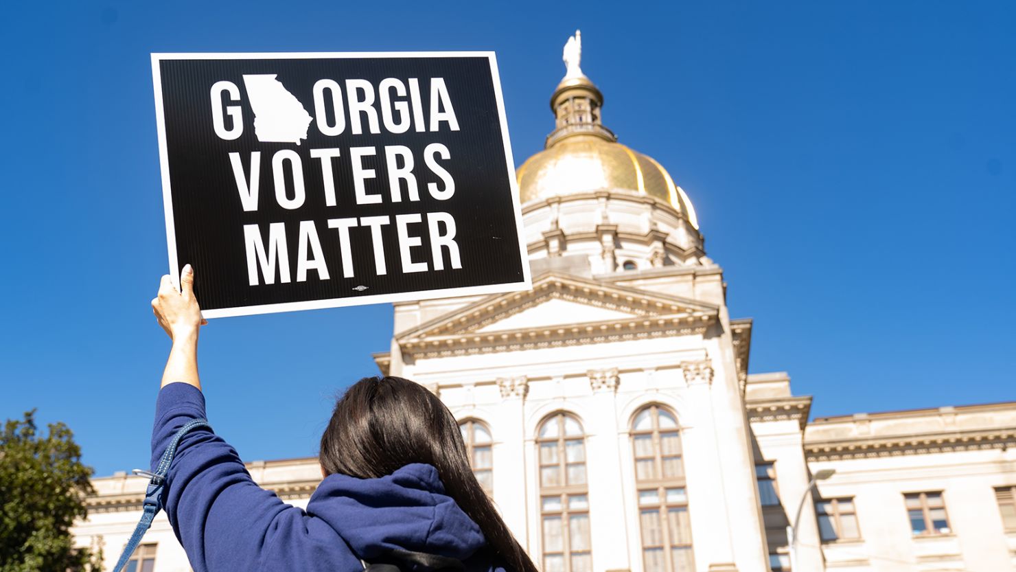 Demonstrators stand outside of the Georgia Capitol building, to oppose the HB 531 bill on March 3, 2021, in Atlanta.