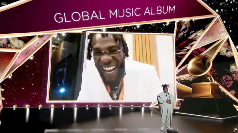 Burna Boy accepts the Best Global Music Album award for 'Twice as Tall' from Chika at the 63rd Annual GRAMMY Awards Premiere Ceremony
