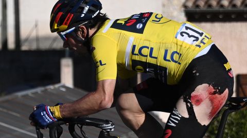 Slovenia's Roglic wearing the overall leader's yellow jersey rides after falling during the eighth stage of the Paris-Nice race.