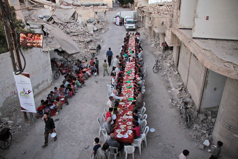 Residents of the war-torn city of Douma break their Ramadan fast on June 18, 2017.