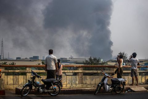 Smoke billows from the industrial zone of the Hlaing Tharyar township in Yangon on March 14. The Chinese Embassy in Myanmar said several <a href=
