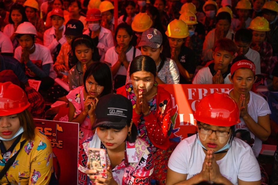 Anti-coup protesters pray in Yangon on March 14.