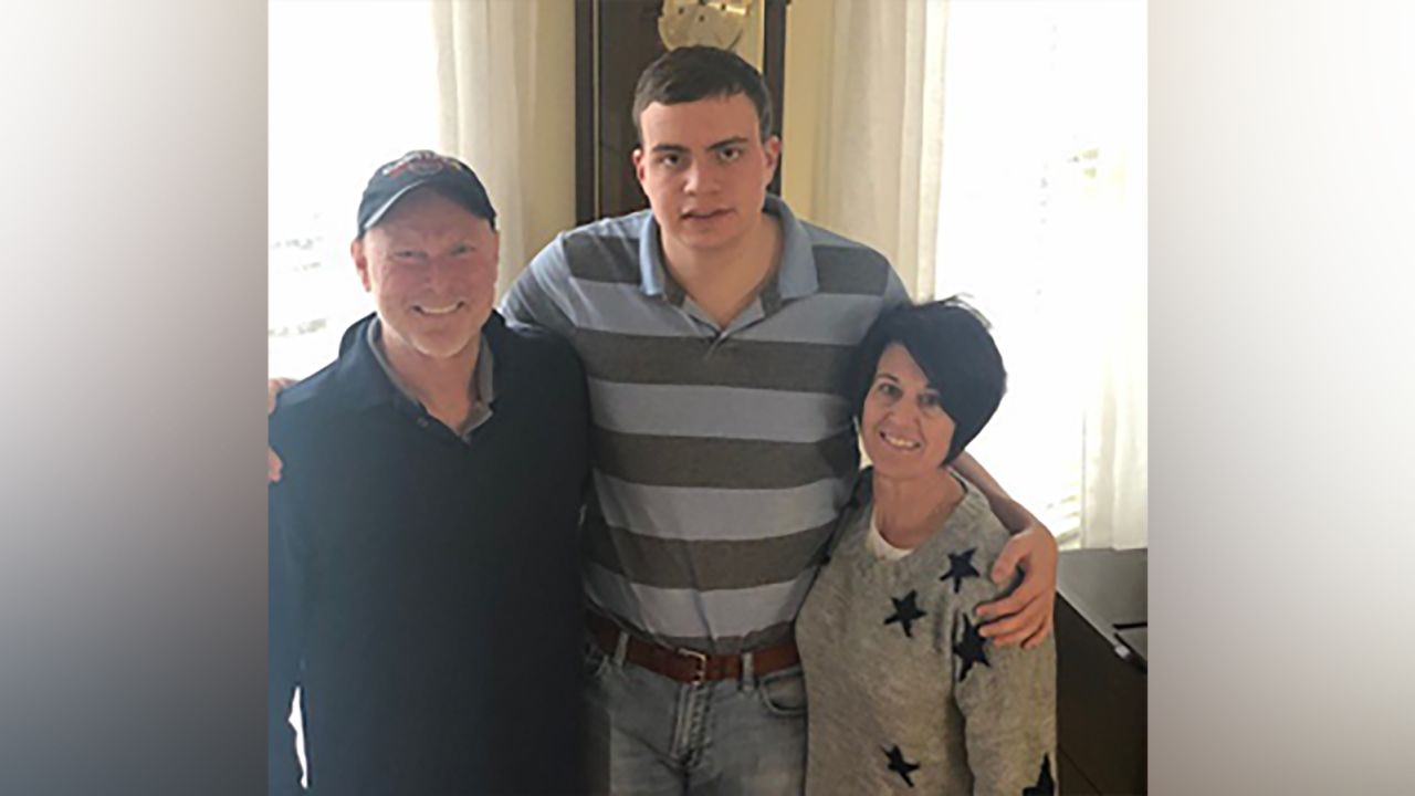 Ryan Lowry stands with his parents, Rob and Tracy.