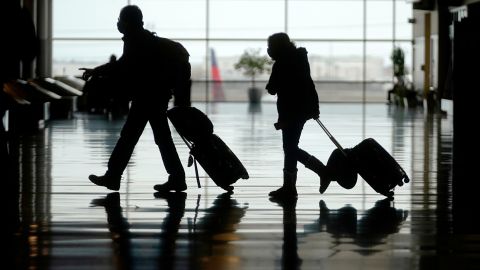 Travelers last week walk through the Salt Lake City International Airport.