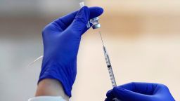 Nurse draws Pfizer's coronavirus vaccine into a syringe, at Integris Baptist Medical Center in Oklahoma City, on December 14, 2020.