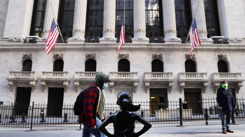 NEW YORK, NEW YORK - FEBRUARY 25: People walk by the New York Stock Exchange (NYSE) on February 25, 2021 in New York City. As a rapid rise in Treasury yields has made equity investors nervous, stocks fell on Thursday with the Dow down 500 points in afternoon trading. (Photo by Spencer Platt/Getty Images)