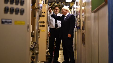 Commander Justin Codd, left, chats with British Prime Minister Boris Johnson aboard Vanguard-class submarine HMS Victorious during a visit to the Faslane naval base north of Glasgow, Scotland on July 29, 2019.