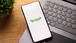 eToro logo on phone screen