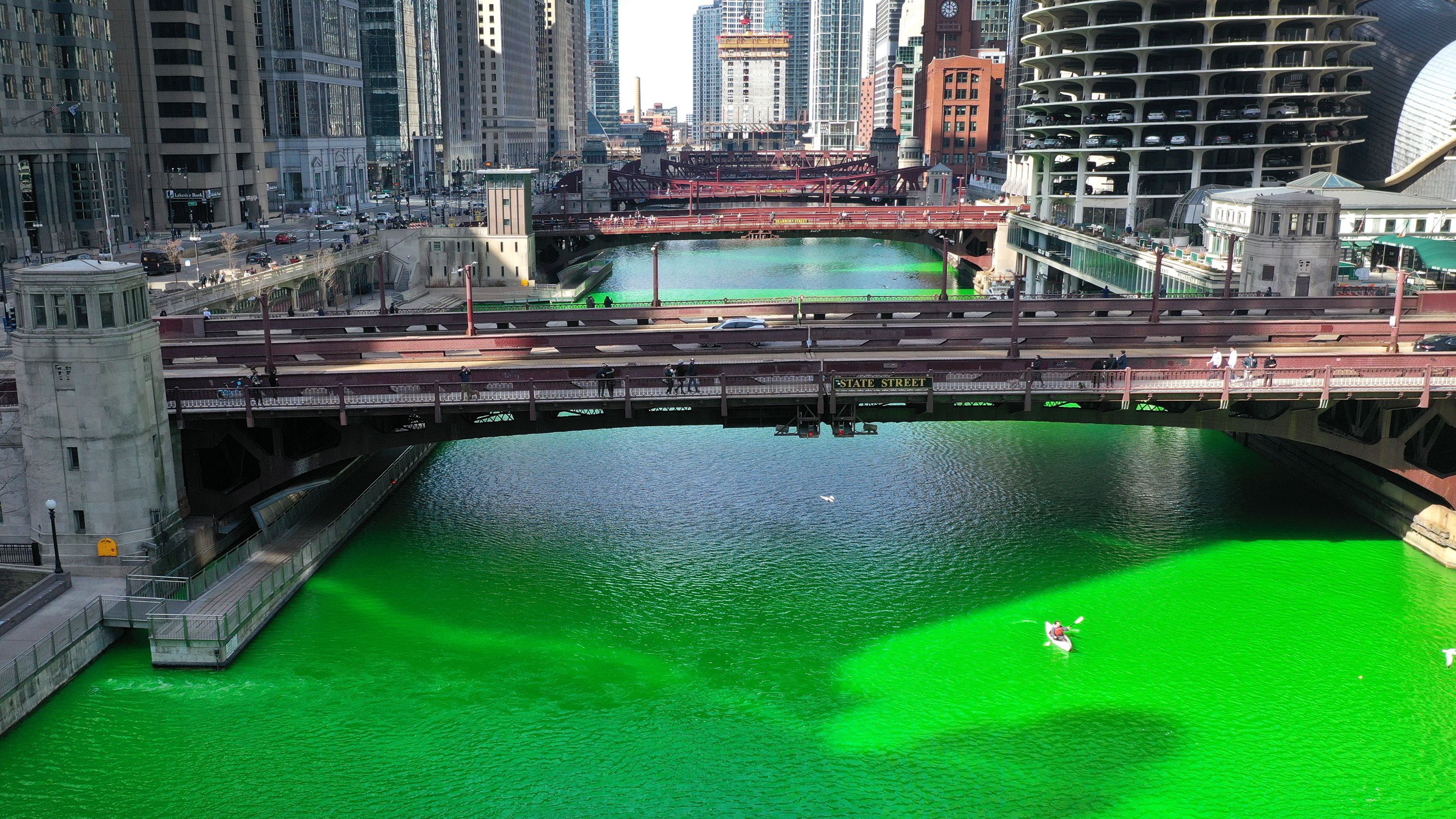 The city surprised residents by dying the river green after initially canceling the St. Patrick's Day tradition because of Covid-19.