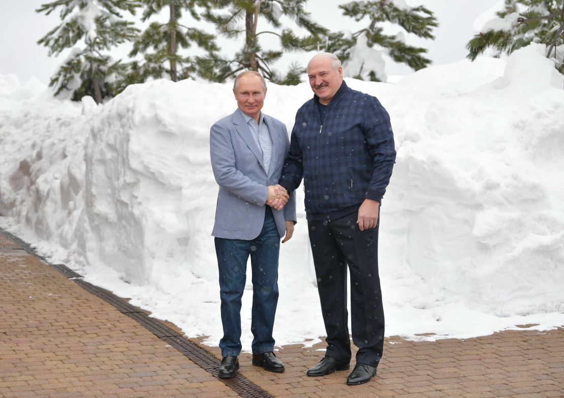 Russian President Vladimir Putin (L) shakes hands with Belarus President Alexander Lukashenko during their meeting in Sochi on February 22, 2021.