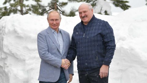 Russian President Vladimir Putin (L) shakes hands with Belarus President Alexander Lukashenko during their meeting in Sochi on February 22, 2021.