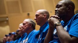 Death row exonerees including Kwame Ajamu, right, listens to speakers during a Witness to Innocence news conference marking the organization's 15th anniversary at the at the National Constitution Center in Philadelphia, Thursday, Nov. 15, 2018. (AP Photo/Matt Rourke)