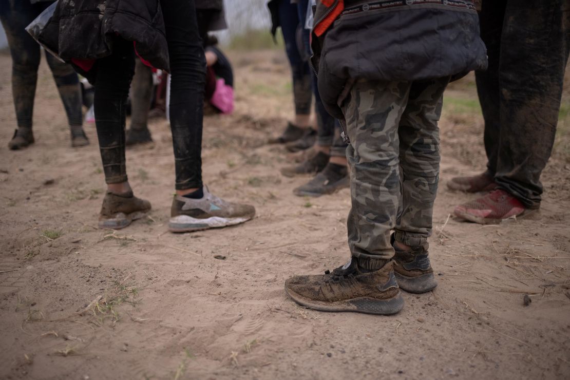 About a dozen asylum seeking unaccompanied minors from Central America are separated from other migrants by U.S. Border Patrol agents after crossing the Rio Grande river into the United States from Mexico on a raft in Penitas, Texas, U.S., March 14, 2021.   