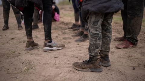 About a dozen asylum seeking unaccompanied minors from Central America are separated from other migrants by U.S. Border Patrol agents after crossing the Rio Grande river into the United States from Mexico on a raft in Penitas, Texas, U.S., March 14, 2021.