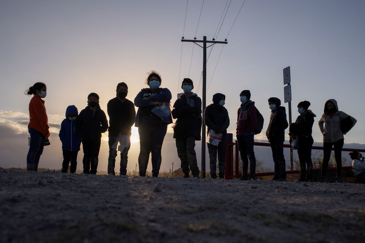 Migrants from Central America await transport in Penitas, Texas, on March 12.