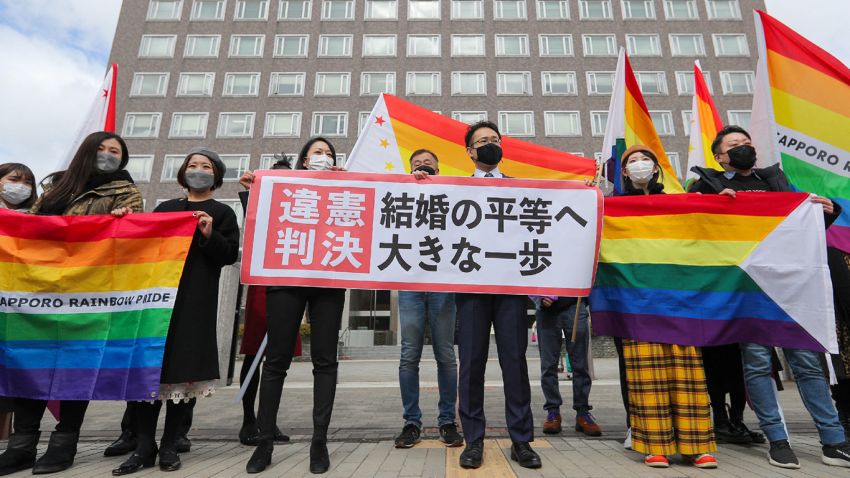 Supporters hold the "unconstitutional decision" flag as they are pleased with the Sapporo District Court's decision that it is unconstitutional to not allow same-sex marriage in Sapporo, Hokkaido prefecture on March 17, 2021. - - Japan OUT (Photo by STR / JIJI PRESS / AFP) / Japan OUT / The erroneous mention[s] appearing in the metadata of this photo by STR has been modified in AFP systems in the following manner: [Sapporo] instead of [Sappoto]. Please immediately remove the erroneous mention[s] from all your online services and delete it (them) from your servers. If you have been authorized by AFP to distribute it (them) to third parties, please ensure that the same actions are carried out by them. Failure to promptly comply with these instructions will entail liability on your part for any continued or post notification usage. Therefore we thank you very much for all your attention and prompt action. We are sorry for the inconvenience this notification may cause and remain at your disposal for any further information you may require. - Japan OUT (Photo by STR/JIJI PRESS/AFP via Getty Images)