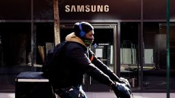 NEW YORK, NY - MARCH 04: A man rides his bike in front Samsung 837 store on March 04, 2021 in New York City. Samsung Electronics Co Ltd is considering four sites en United States, for a new $17 billion chip plant. (Photo by Emaz/VIEWpress)