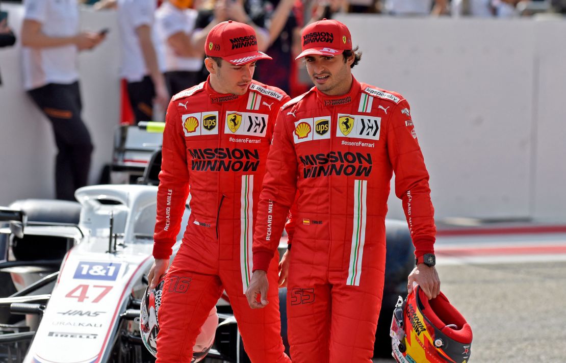 Leclerc (left) and Sainz (right) chat ahead of the first day of the F1 pre-season testing at the Bahrain International Circuit.