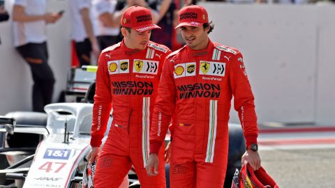 Leclerc (left) and Sainz (right) chat ahead of the first day of the F1 pre-season testing at the Bahrain International Circuit.