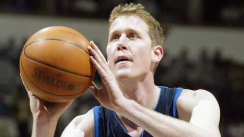 Shawn Bradley of the Dallas Mavericks shoots a free throw during a 2003 game against the Minnesota Timberwolves.  