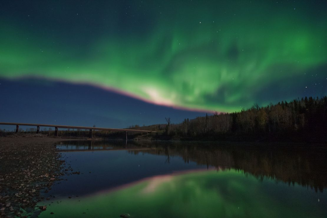 The aurora borealis, captured by Dene photographer and conservationist Ryan Dickie, shines bright over the Fort Nelson River in far northeast British Columbia, Canada. 